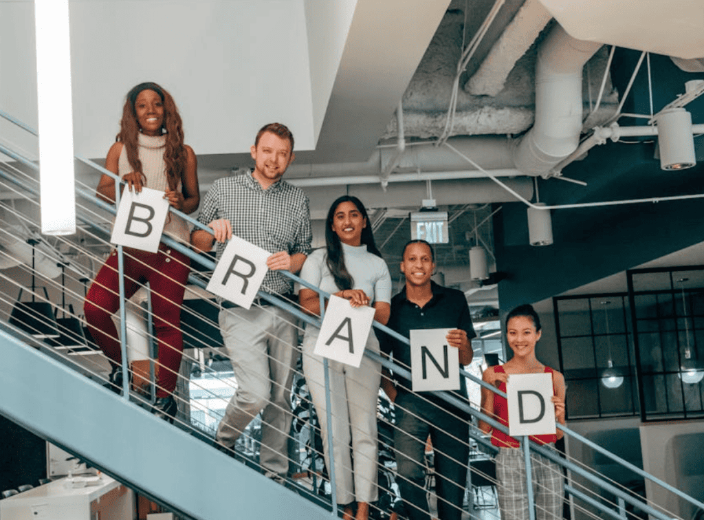 People on a stair showing BRAND