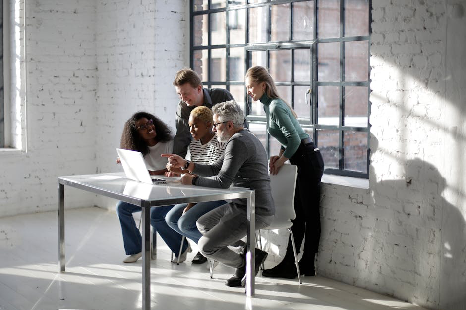 A diverse team collaborating on a project - Drive organic growth people working on a computer