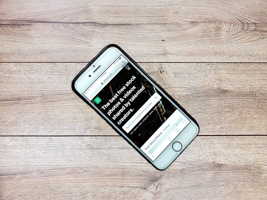 of a clean, mobile-responsive website design - Boost online presence phone on wood
