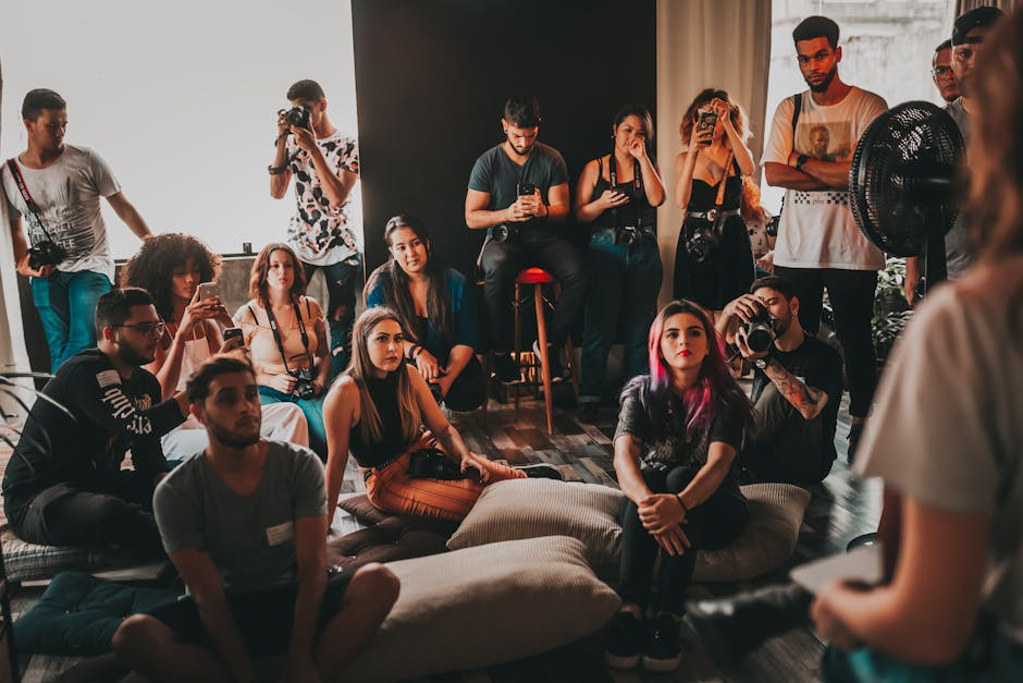 A person actively listening during a conversation, symbolizing deep engagement - Authentic community engagement listing people on a dark floor