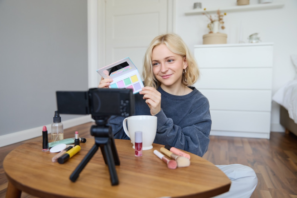 girl showing makeup and filming 