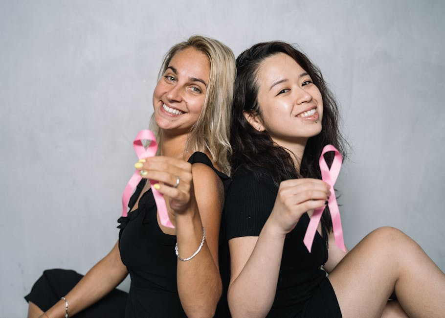 image of a brand supporting a social cause - Attract target audience Two women holding pink ribbons.