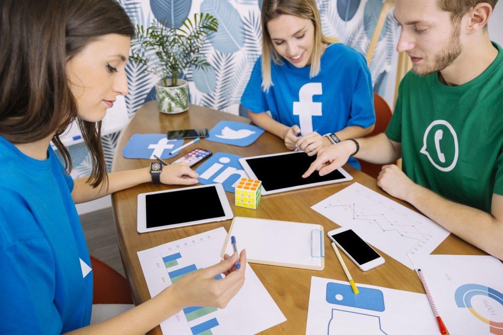 discussing of three peoples facebook t shirt and whatsapp
