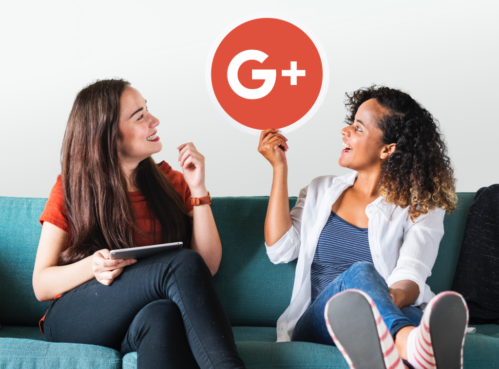 two girls on a couch with a plus G