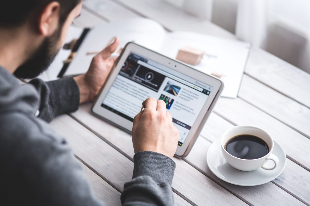 worker reading news with tablet